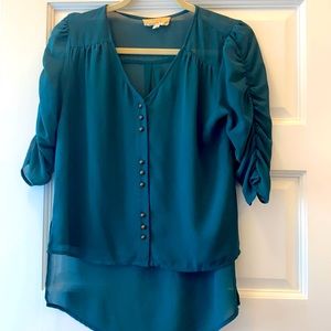 Teal blouse with brass buttons